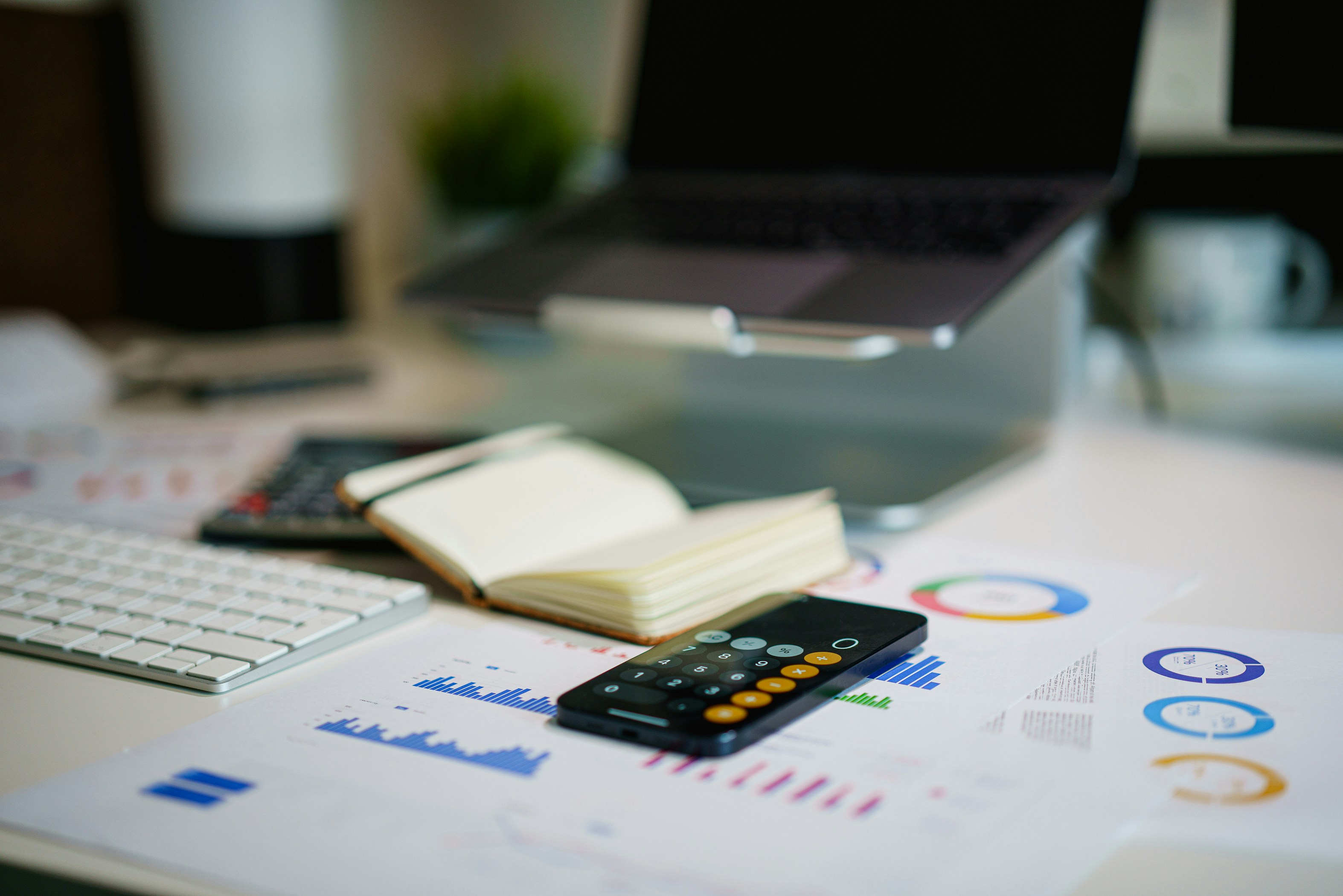 Financial reports and charts on desk