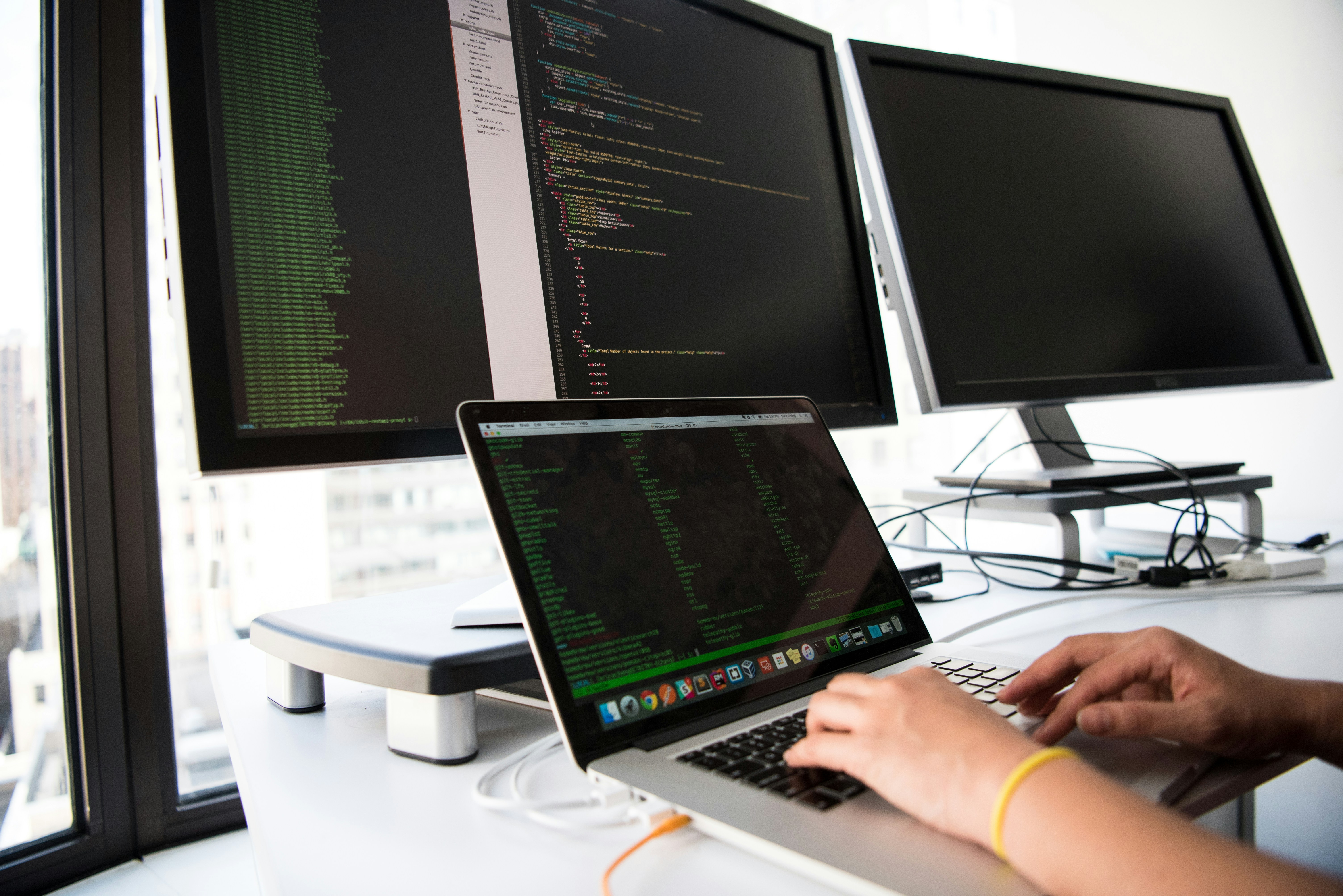 Developer working across multiple screens