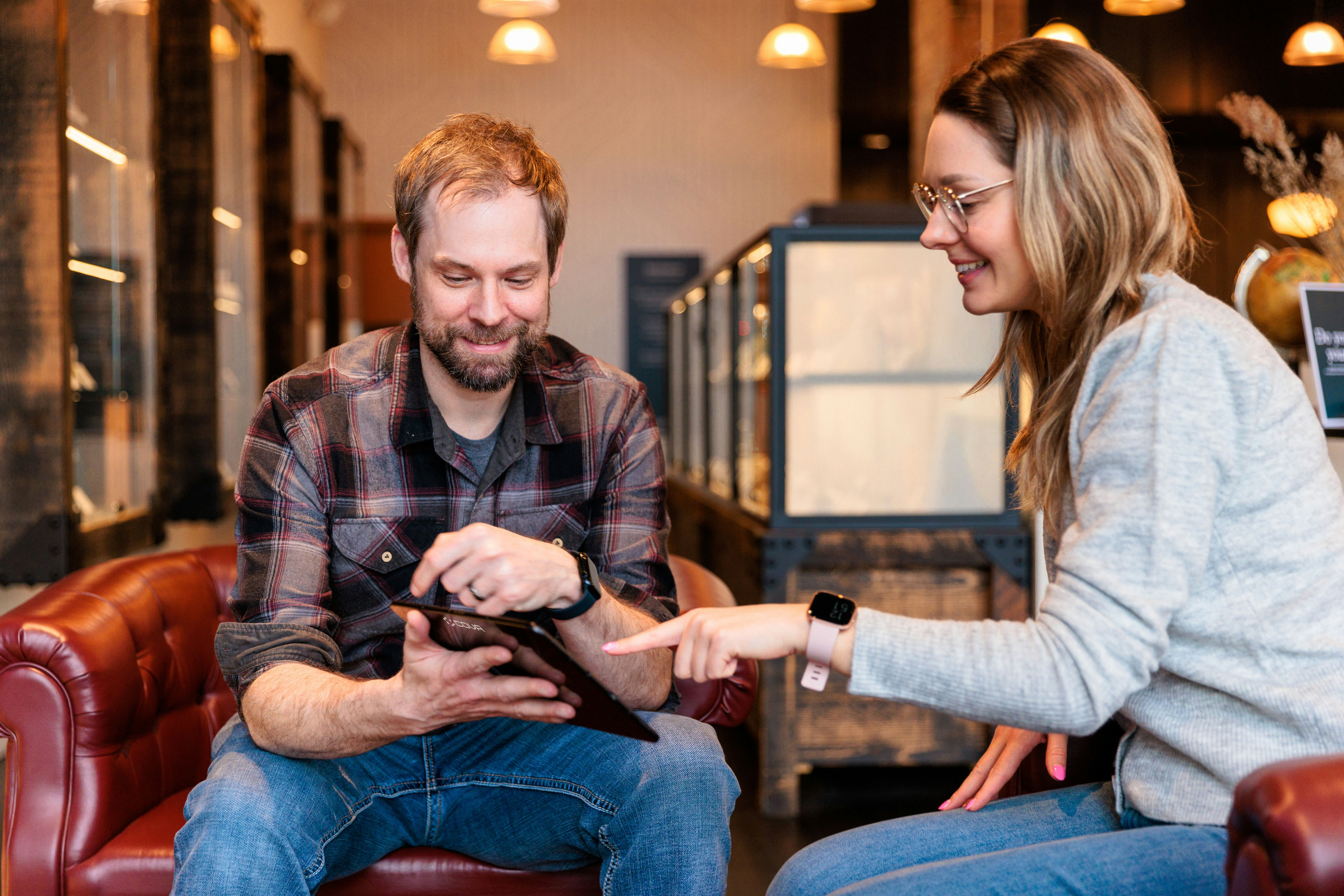 Two colleagues reviewing on tablet